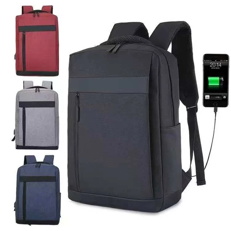 USB Charging Laptop Backpack with multiple compartments, laptop storage section and external USB charging port available in black, blue, grey and red colors.